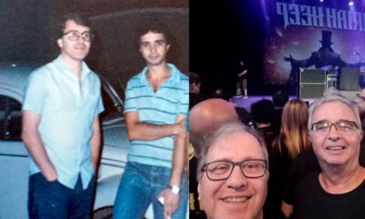 Uma composição fotográfica nostálgica e rica em detalhes sobre uma mesa de madeira envelhecida. À esquerda, uma capa de vinil (LP) bem manuseada do "Deep Purple in Rock" ao lado de um montinho de moedas antigas brasileiras de 1973. À direita, um smartphone mostrando ingressos digitais para um show do AC/DC. No centro, unindo o passado e o presente, duas fotos: uma antiga e desbotada (anos 70) mostrando dois jovens de cabelos compridos e sapatos plataforma, e uma foto atual e vibrante de dois senhores sorridentes brindando com camisetas de banda. A iluminação é quente, vinda de um abajur estilo retrô. Estilo realista de alta resolução. Proporção 16:9 (820x468).